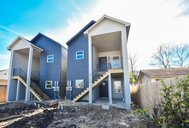 rear view of property with a balcony