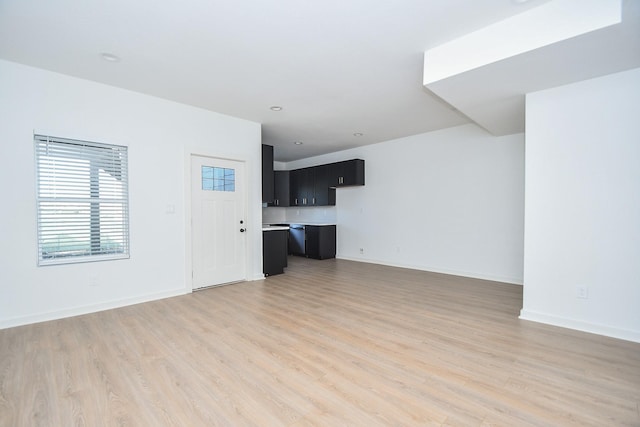 unfurnished living room with light wood-type flooring