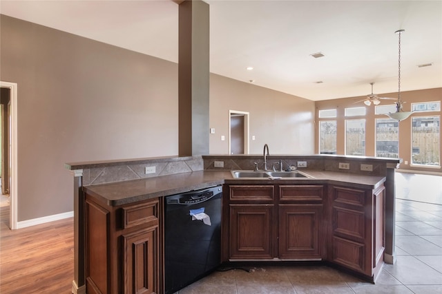 kitchen featuring ceiling fan, sink, black dishwasher, pendant lighting, and light tile patterned floors