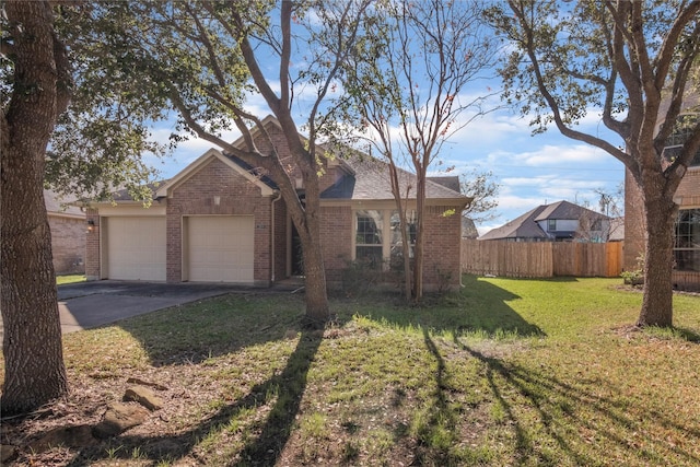 ranch-style home featuring a front yard and a garage