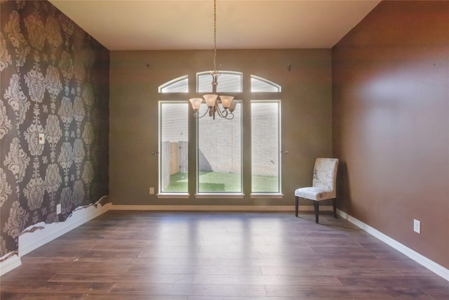 interior space featuring dark hardwood / wood-style flooring and a chandelier