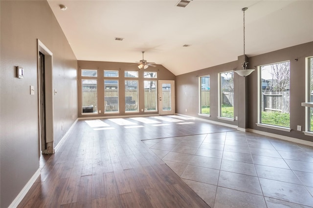 interior space featuring dark hardwood / wood-style floors, ceiling fan, and lofted ceiling