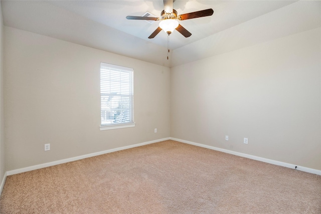 carpeted empty room with ceiling fan and vaulted ceiling