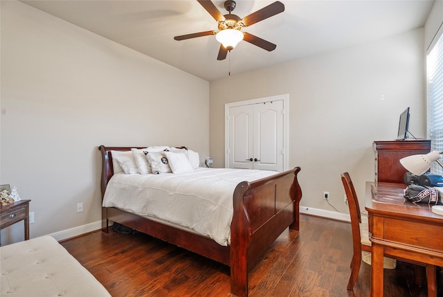 bedroom featuring ceiling fan and dark wood-type flooring