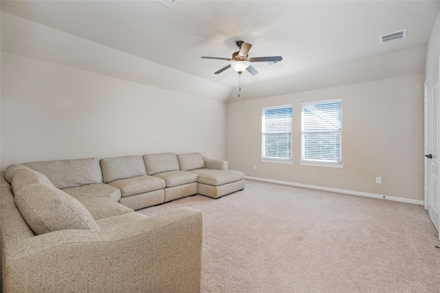 carpeted living room featuring ceiling fan and vaulted ceiling