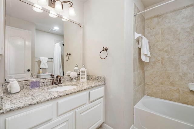 bathroom featuring shower / bath combination with curtain and vanity