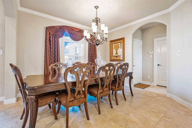 dining area with ornamental molding and a notable chandelier