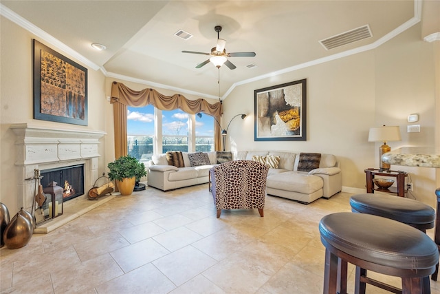 living room featuring ceiling fan and crown molding