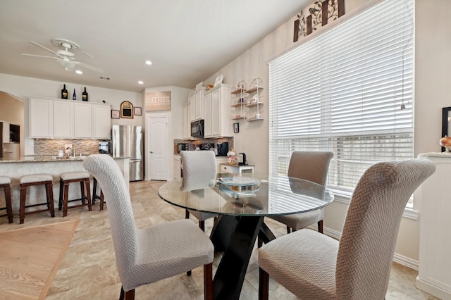 dining space with ceiling fan