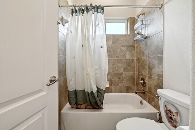 bathroom featuring shower / bath combo and toilet