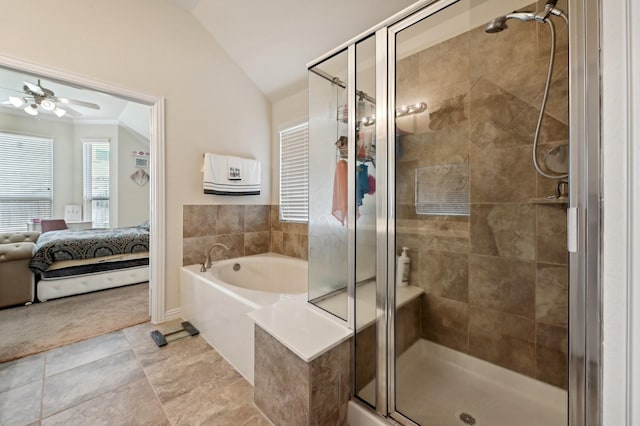 bathroom with tile patterned flooring, ceiling fan, separate shower and tub, and lofted ceiling