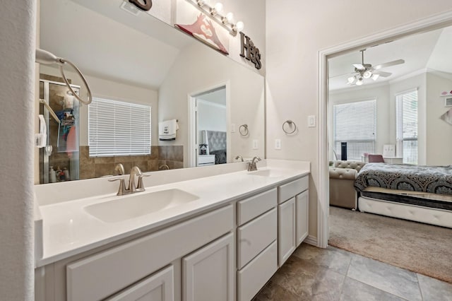 bathroom featuring vanity, vaulted ceiling, tile patterned flooring, ceiling fan, and ornamental molding