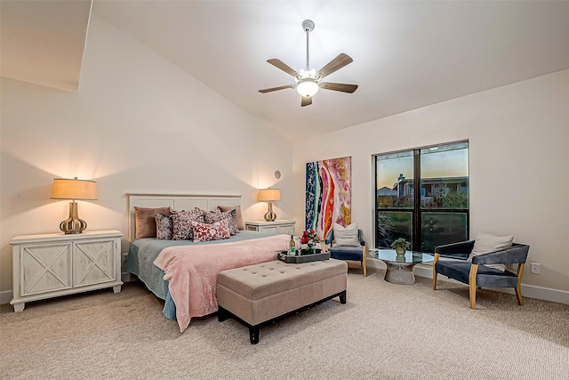 carpeted bedroom with ceiling fan and high vaulted ceiling