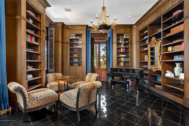 living area with a chandelier and built in features