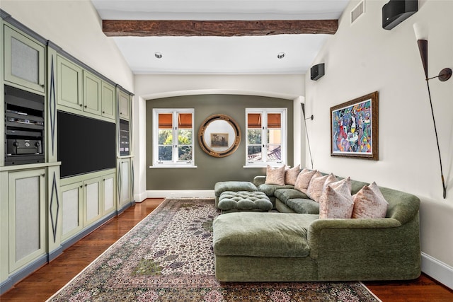 living room featuring vaulted ceiling with beams and dark hardwood / wood-style flooring