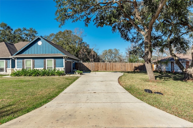 view of front of property with a front lawn and a garage