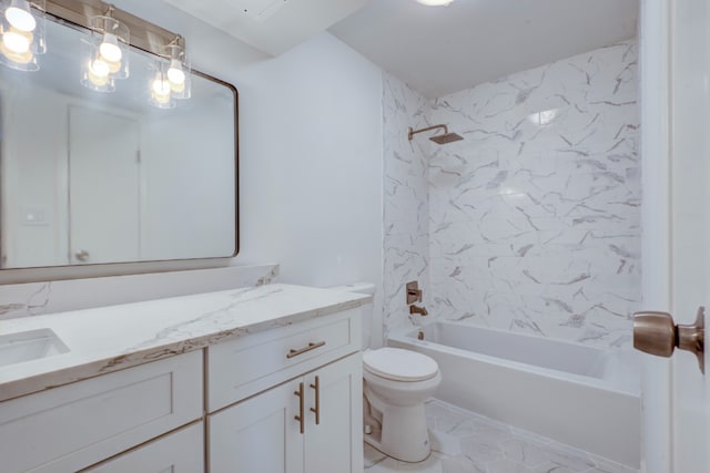 full bathroom with vanity, tiled shower / bath combo, and toilet