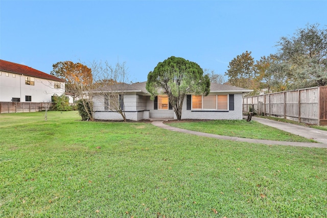 rear view of house with a lawn