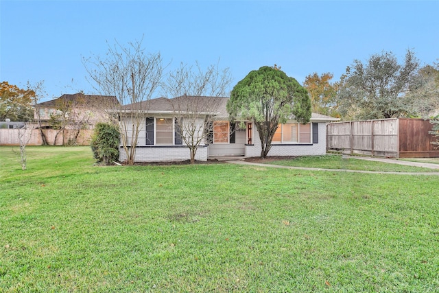 ranch-style house with a front lawn