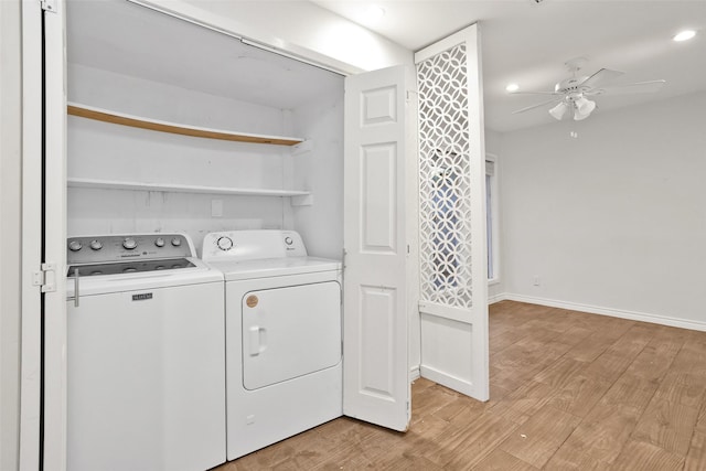 laundry area with ceiling fan, light hardwood / wood-style floors, and separate washer and dryer