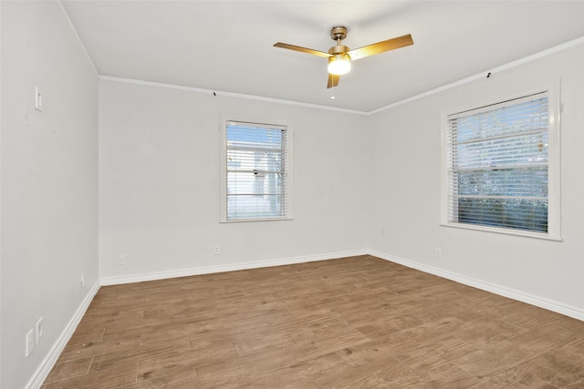 unfurnished room with ceiling fan, light hardwood / wood-style floors, and crown molding