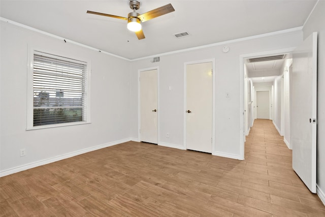 unfurnished bedroom with ceiling fan, light hardwood / wood-style floors, and ornamental molding