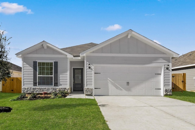 ranch-style house with a garage and a front yard