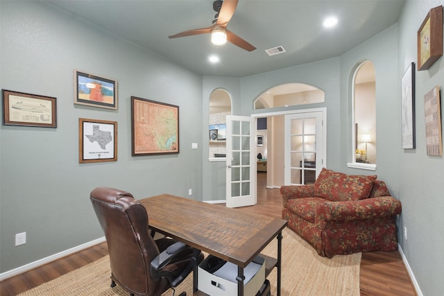 home office with french doors, hardwood / wood-style flooring, and ceiling fan