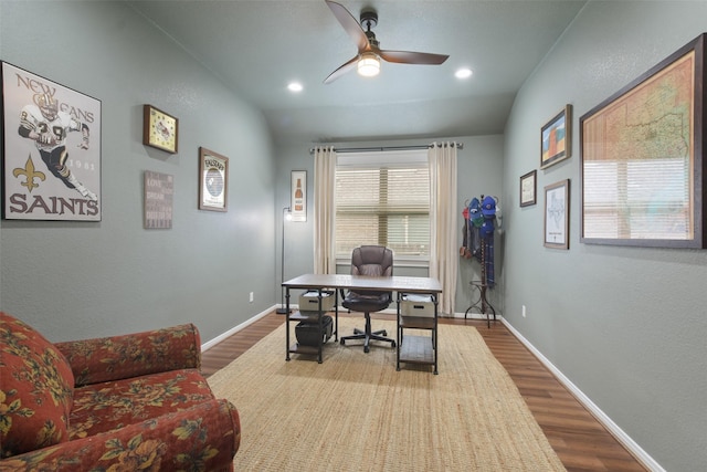 home office with hardwood / wood-style floors, ceiling fan, and vaulted ceiling