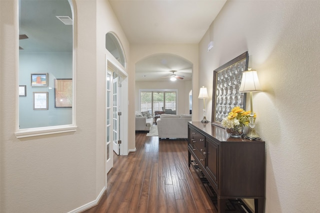 hall with dark hardwood / wood-style flooring