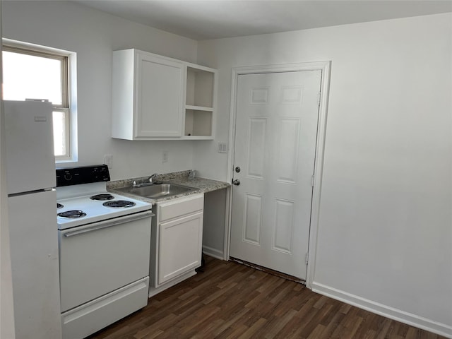 kitchen featuring dark hardwood / wood-style floors, white cabinetry, white appliances, and sink