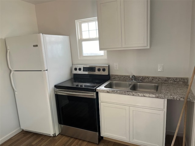 kitchen with white cabinetry, sink, dark wood-type flooring, white refrigerator, and stainless steel electric range