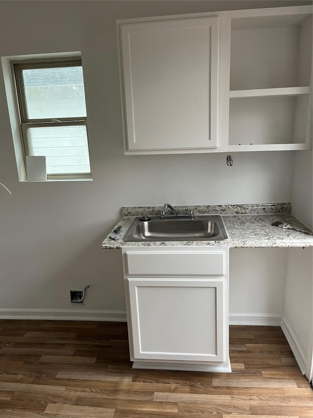 washroom featuring sink and light hardwood / wood-style flooring