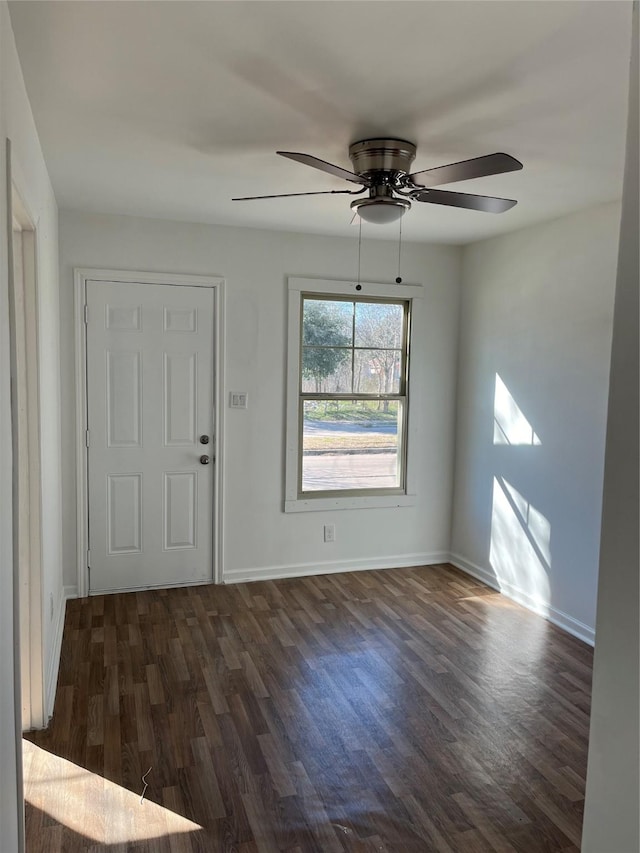 foyer featuring dark hardwood / wood-style flooring and ceiling fan