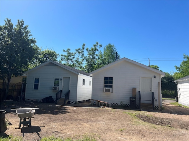 back of property featuring cooling unit