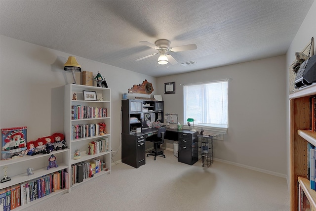 office area featuring ceiling fan and a textured ceiling