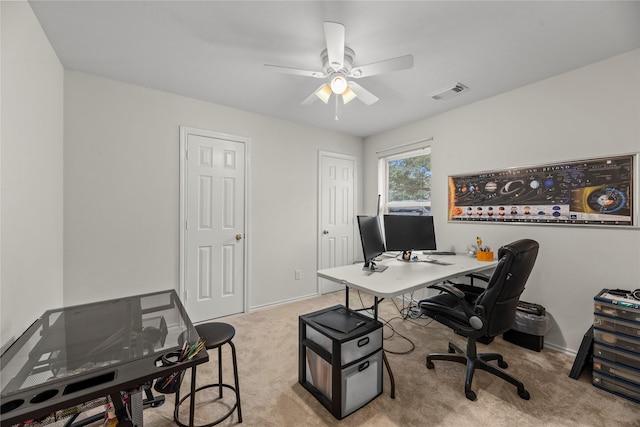 home office featuring ceiling fan and light colored carpet