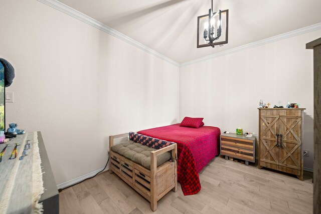 bedroom with wood-type flooring, crown molding, and an inviting chandelier