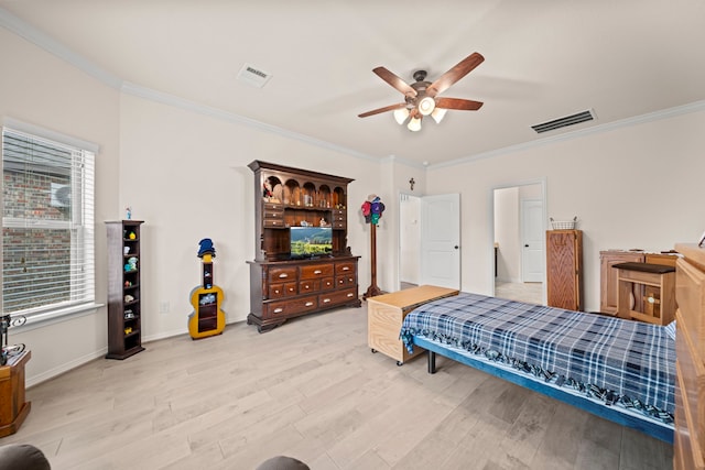 bedroom with light wood-type flooring, ceiling fan, and crown molding