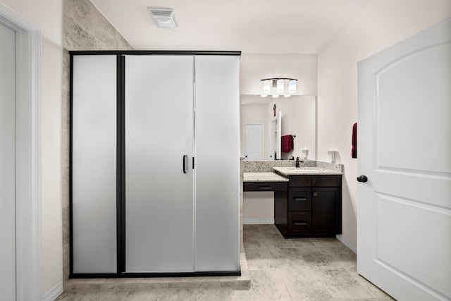 bathroom featuring vanity and walk in shower