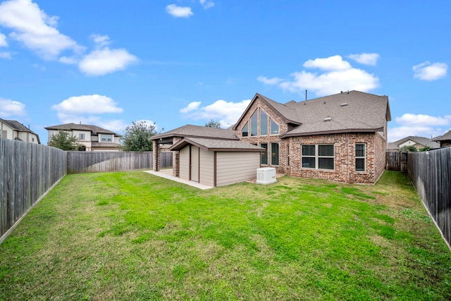 back of property featuring a yard