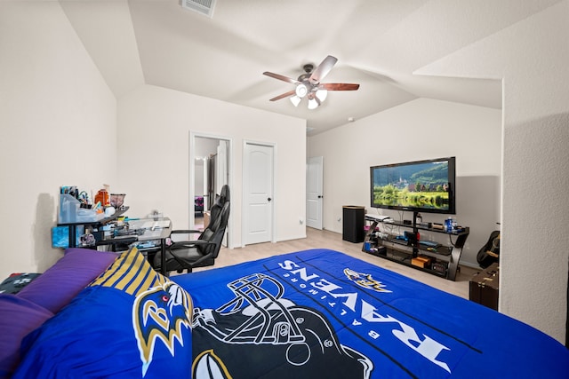 bedroom featuring connected bathroom, ceiling fan, and lofted ceiling