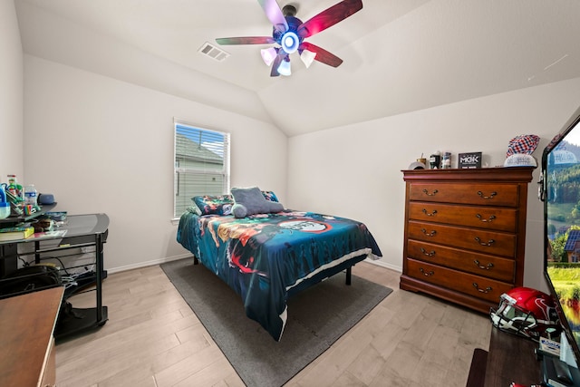 bedroom featuring light hardwood / wood-style floors, ceiling fan, and lofted ceiling