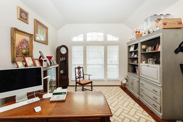 office area featuring vaulted ceiling and dark wood-type flooring