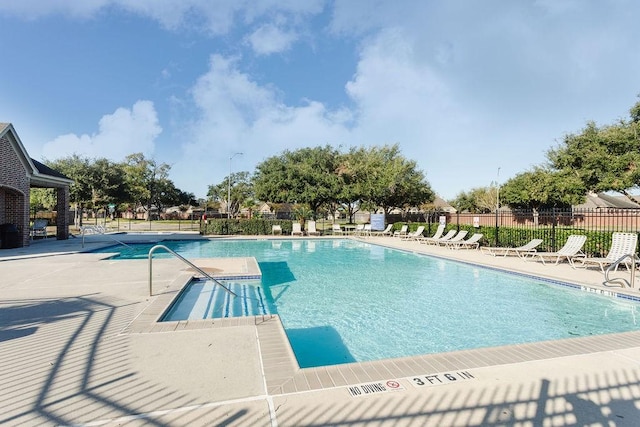 view of swimming pool featuring a patio area