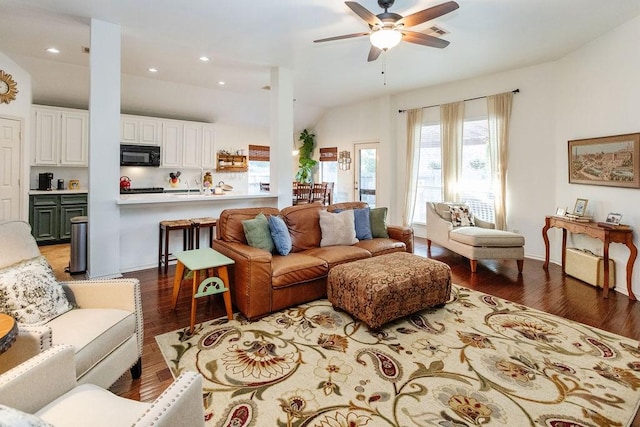 living room featuring hardwood / wood-style flooring, ceiling fan, lofted ceiling, and sink