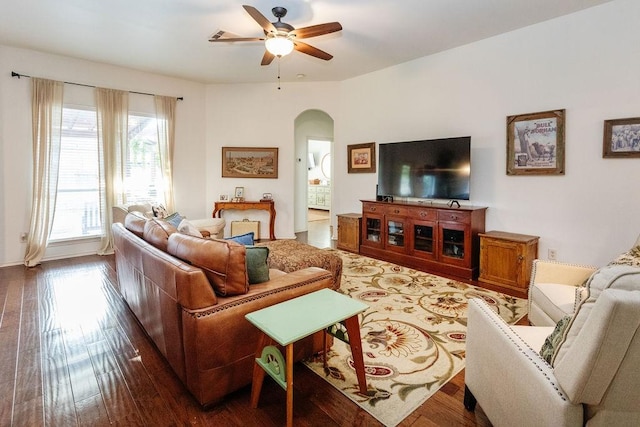 living room featuring ceiling fan and wood-type flooring