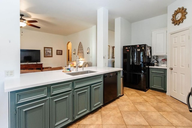 kitchen with black appliances, sink, ceiling fan, light tile patterned floors, and white cabinetry