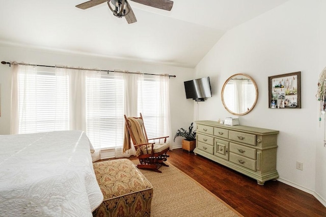 bedroom featuring dark hardwood / wood-style floors, ceiling fan, and lofted ceiling