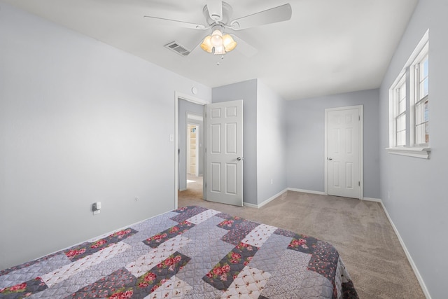 unfurnished bedroom with light carpet and ceiling fan